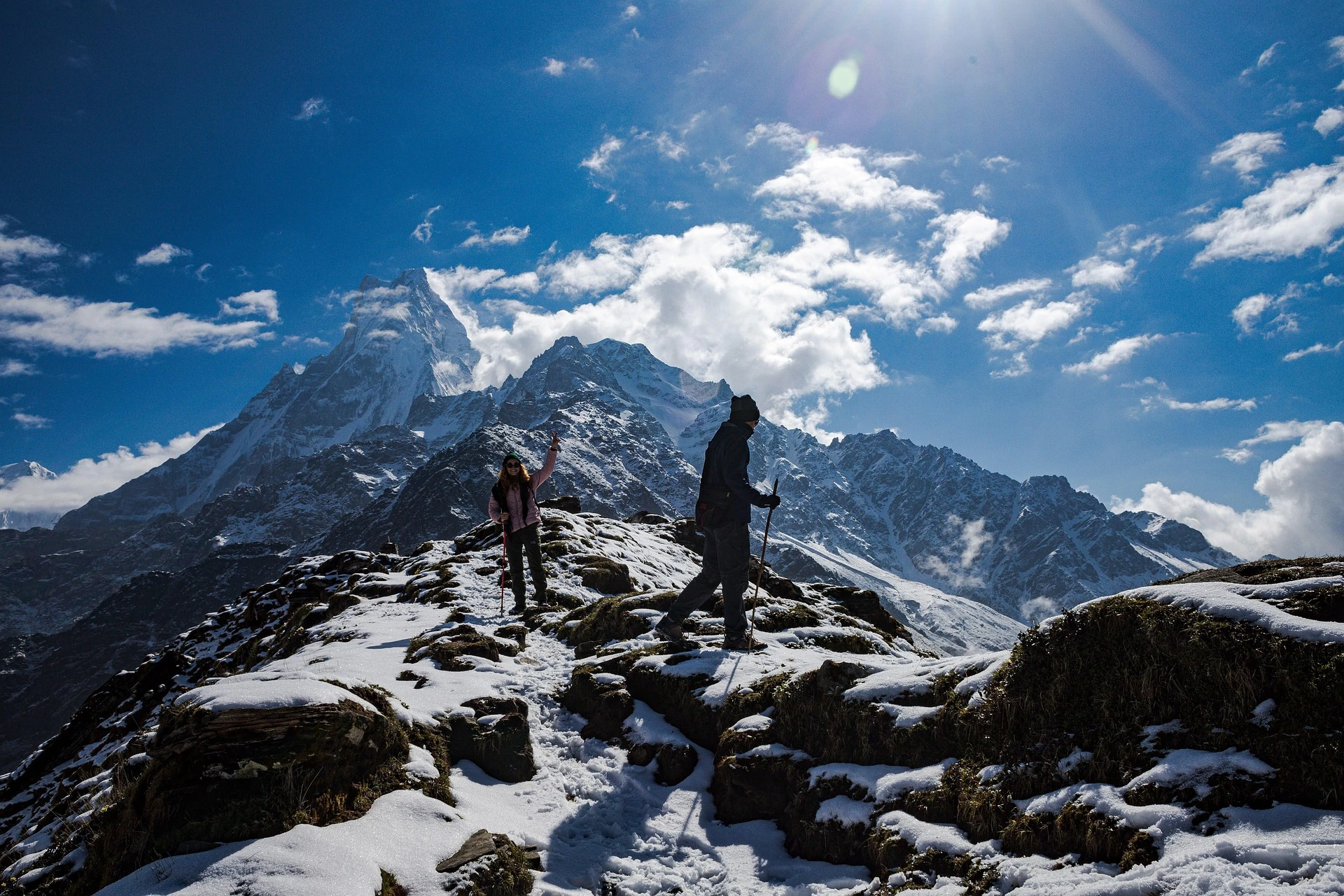 Trekkers crossing a Himalayan mountain landscape